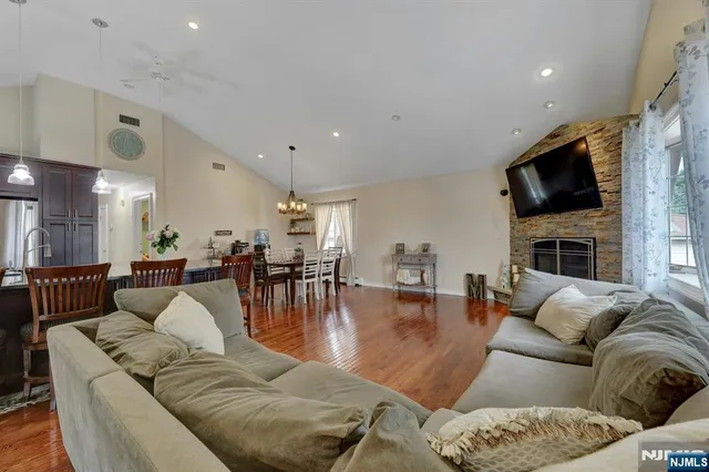 a living room with furniture fireplace and a flat screen tv