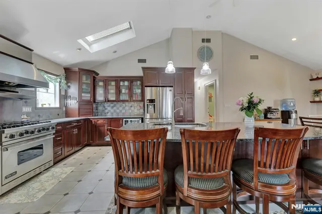 a dining room with furniture a window and wooden floor