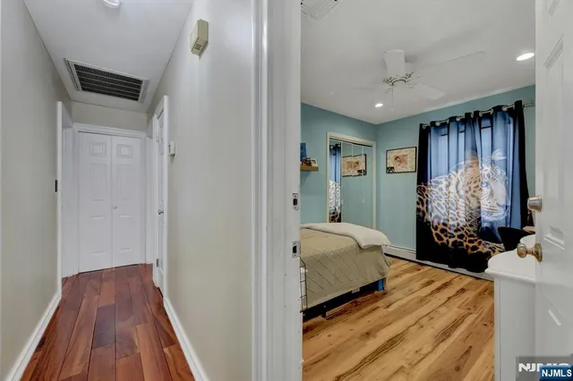 a bedroom with bed and a window