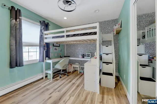 a view of a livingroom with furniture and a window