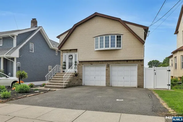 a front view of a house with a garage