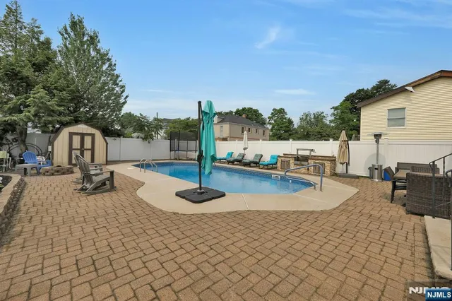 a view of a swimming pool with a patio