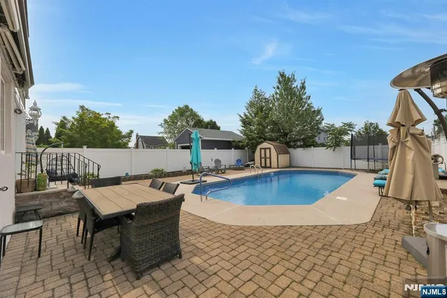 a view of a chairs and table in the patio