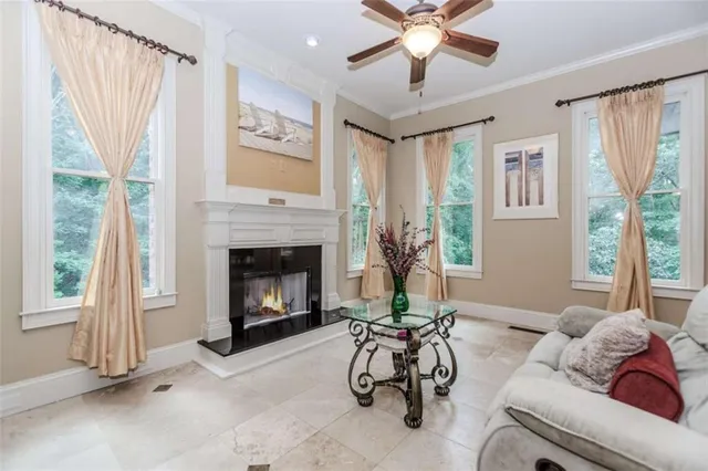 a living room with furniture and a fireplace