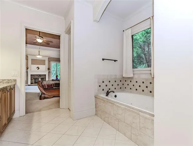 a bathroom with a bathtub and a shower