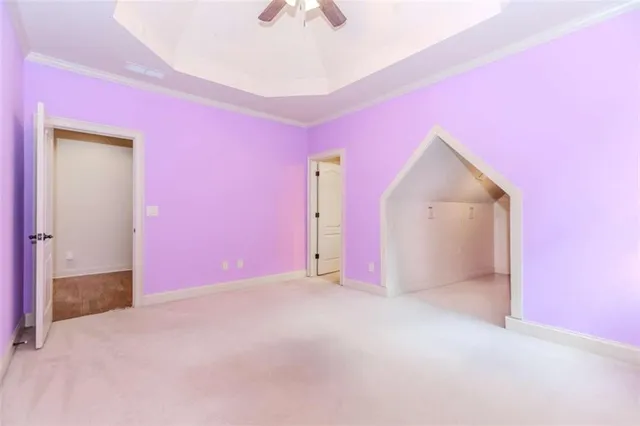 a bathroom with a granite countertop sink a toilet and a mirror