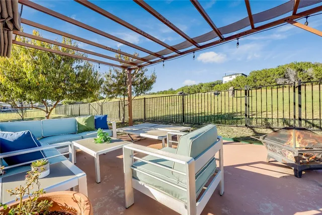 a view of a patio with couches and chairs