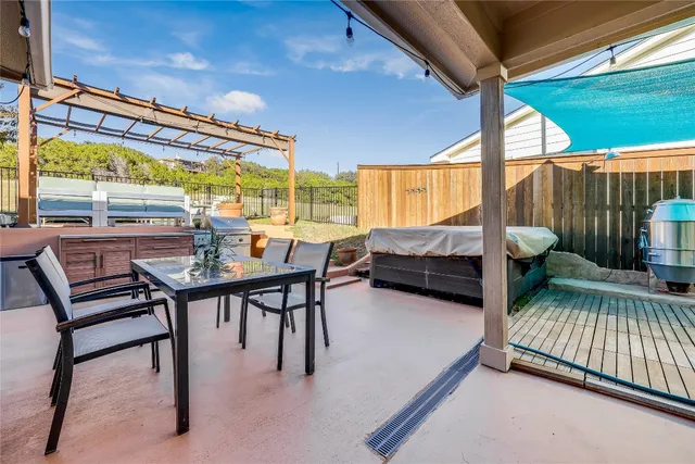 a bedroom with furniture and a large window