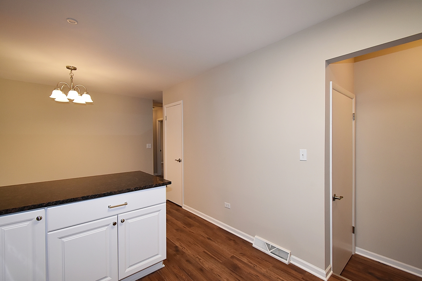 1191 Meadow Lane Elgin, IL 60123 - Photo 11 of 35 a view of a hallway with wooden floor