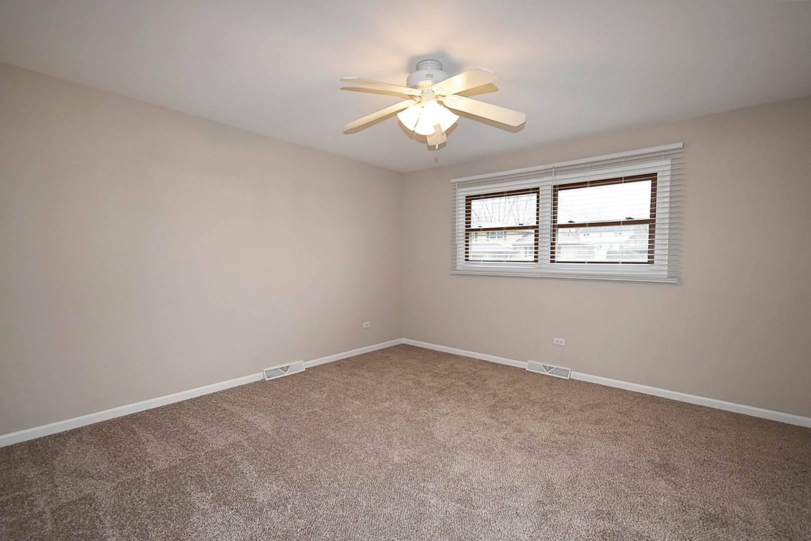 1191 Meadow Lane Elgin, IL 60123 - Photo 16 of 35 an empty room with windows and fan