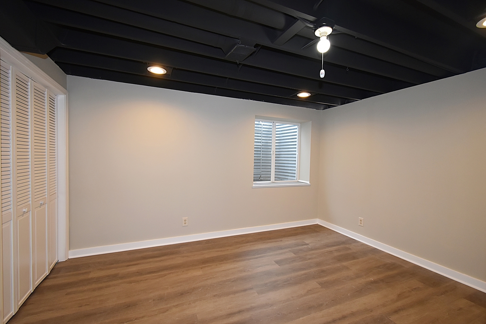 1191 Meadow Lane Elgin, IL 60123 - Photo 24 of 35 a view of empty room with wooden floor and fan