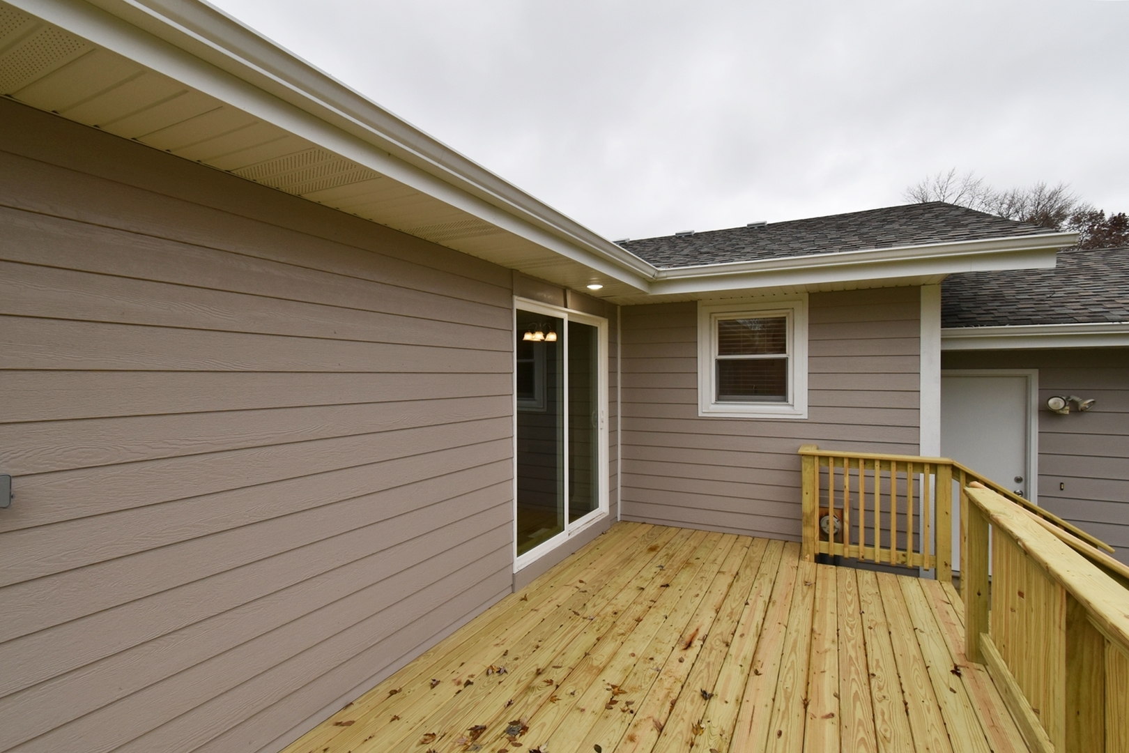 1191 Meadow Lane Elgin, IL 60123 - Photo 29 of 35 a view of a house with wooden deck