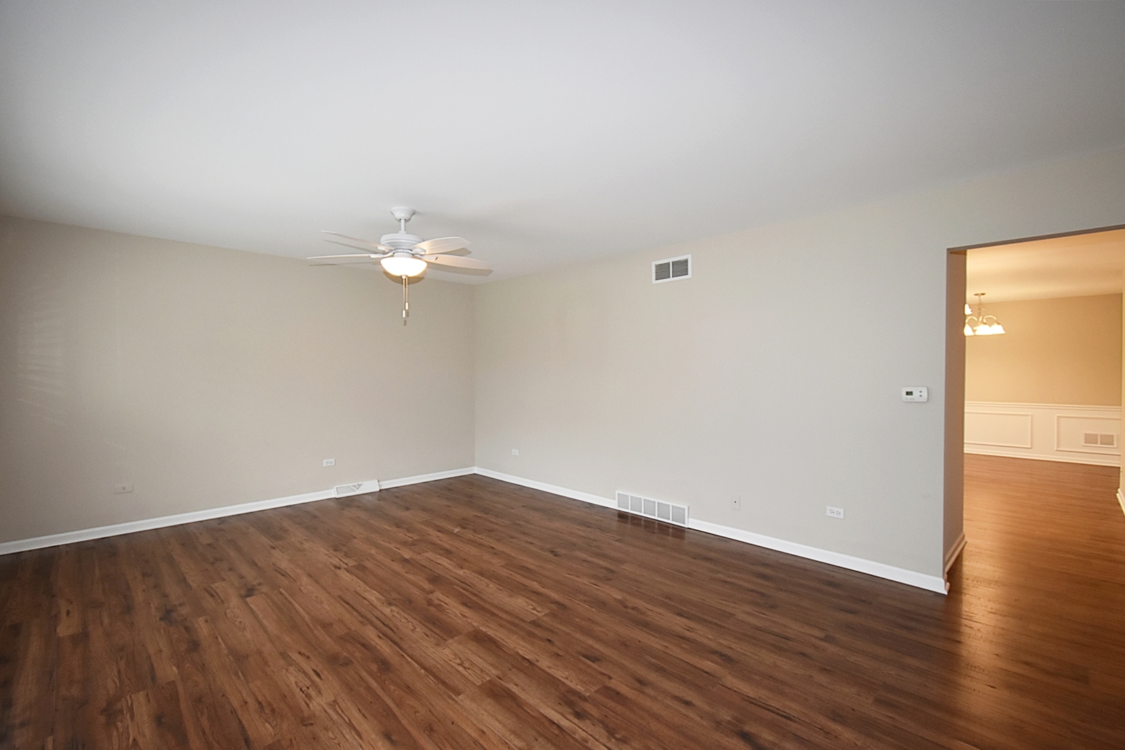 1191 Meadow Lane Elgin, IL 60123 - Photo 5 of 35 a view of a room with wooden floor and natural light