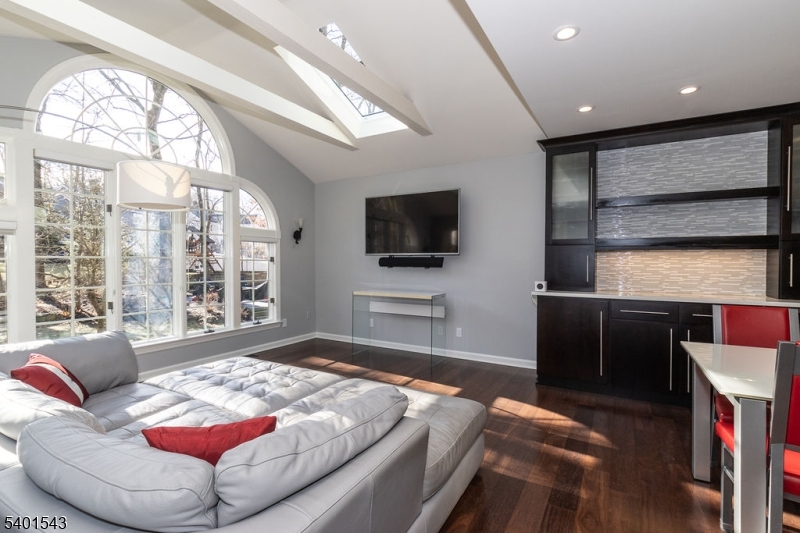 11 Wickham Way Chatham, NJ 07928 - Photo 17 of 47 a bedroom with a large bed and a flat tv screen on dresser