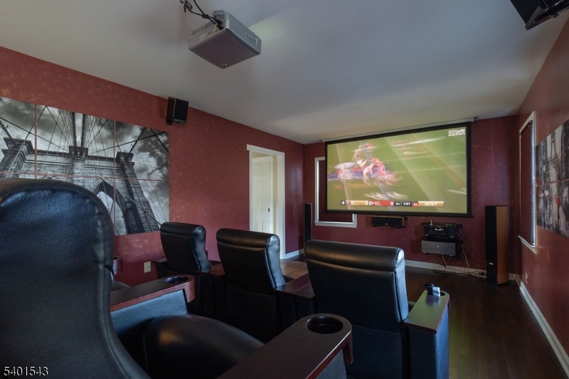 11 Wickham Way Chatham, NJ 07928 - Photo 22 of 47 a room with furniture projector and screen