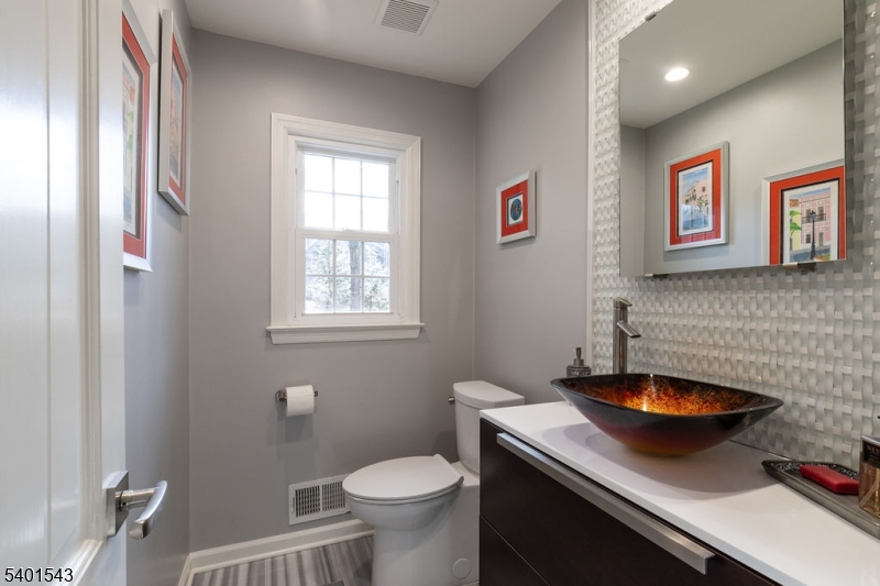 11 Wickham Way Chatham, NJ 07928 - Photo 26 of 47 a bathroom with a sink a toilet and a window