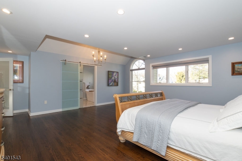 11 Wickham Way Chatham, NJ 07928 - Photo 28 of 47 a spacious bedroom with a bed and a window