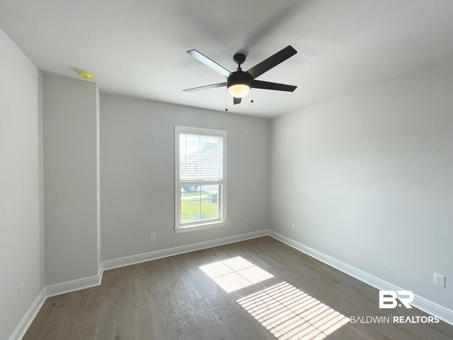 1424 Fenton Circle Foley, AL 36535 - Photo 13 of 20 Empty room with ceiling fan and hardwood / wood-style floors