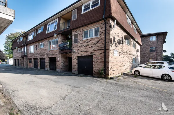 a view of a car park in front of a building