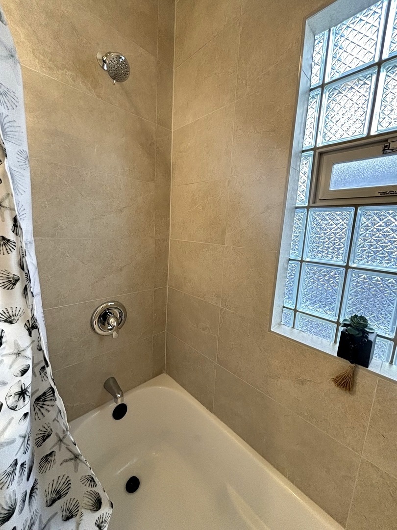 4741 North Keating Avenue Chicago, IL 60630 - Photo 13 of 25 a bathroom with a bathtub
