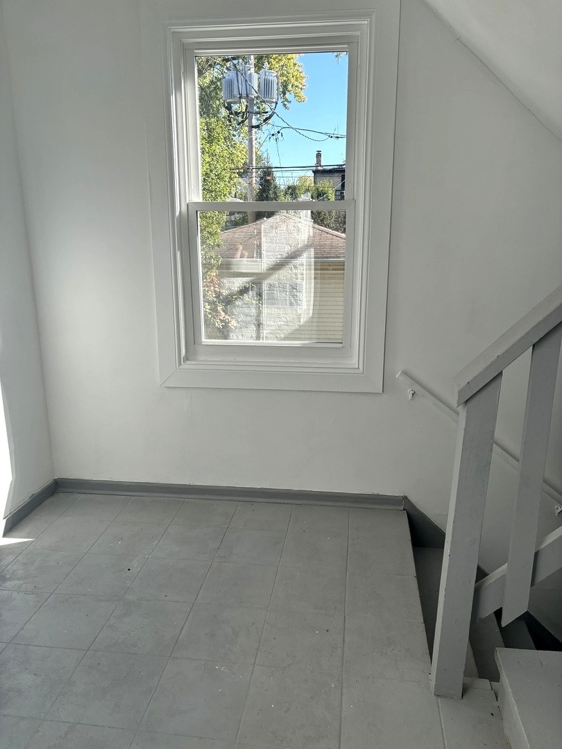 4741 North Keating Avenue Chicago, IL 60630 - Photo 20 of 25 a view of an empty room with a window