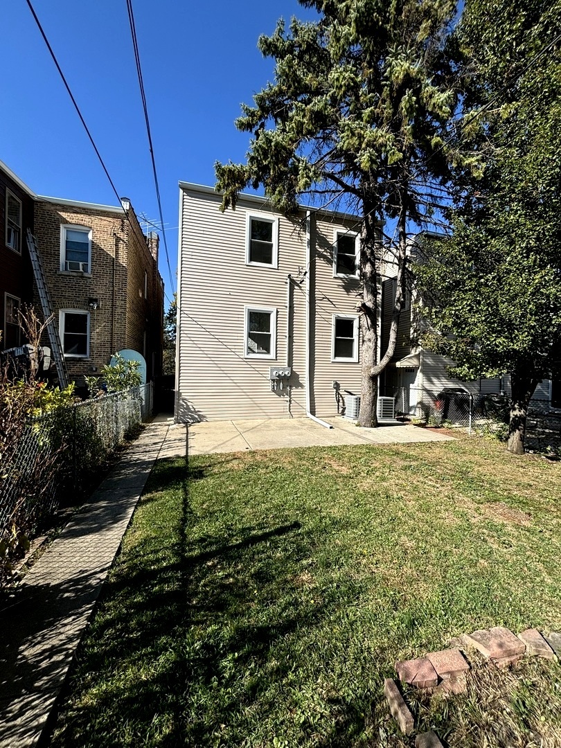 4741 North Keating Avenue Chicago, IL 60630 - Photo 24 of 25 a front view of house with yard