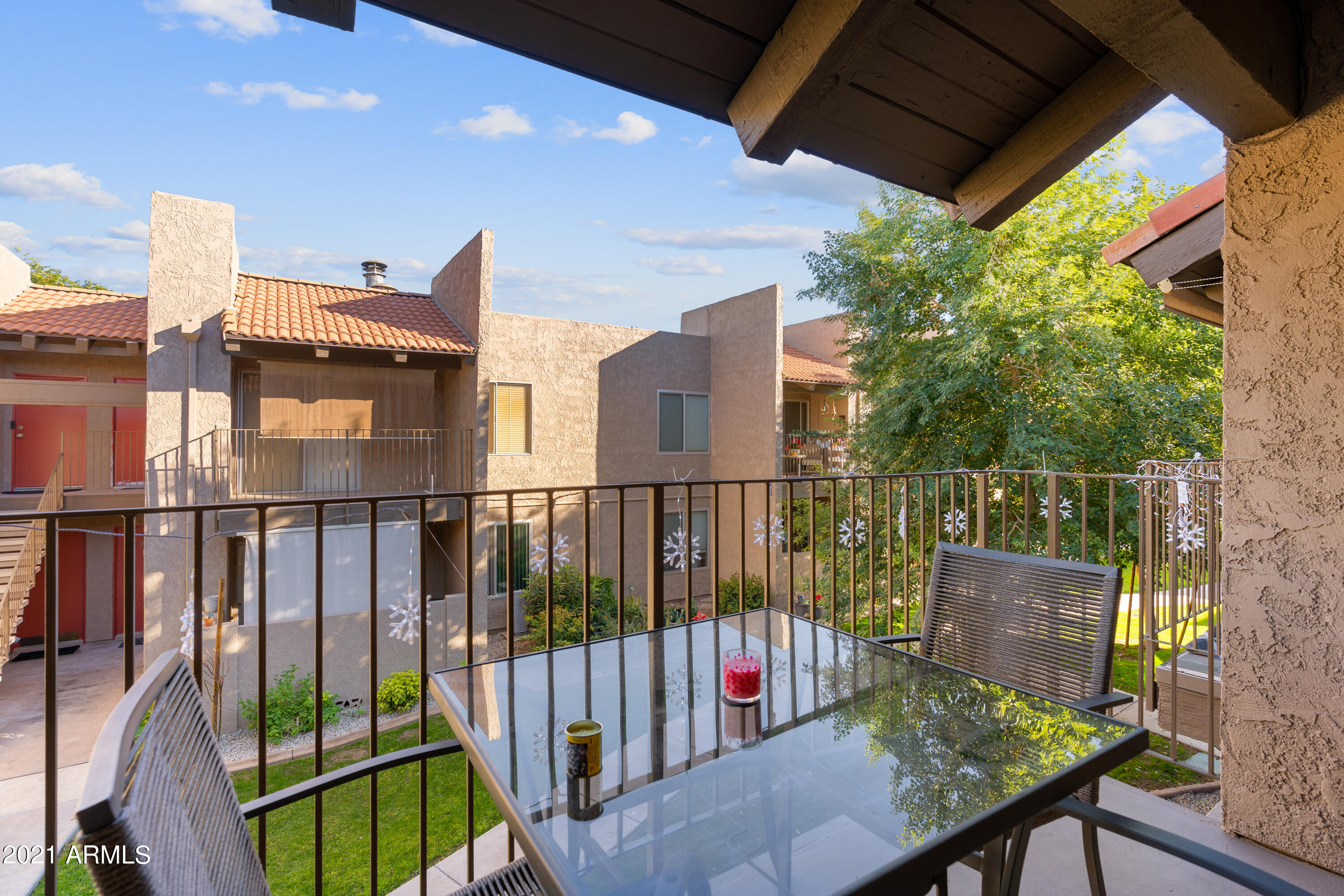 5525 East Thomas Road, Unit Q7 Phoenix, AZ 85018 - Photo 8 of 14 a view of a balcony with furniture