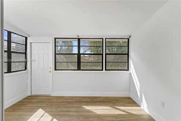 a view of an empty room with a window