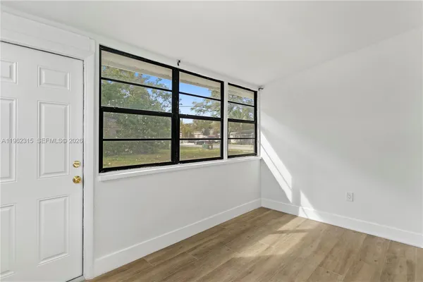a view of an empty room with a window