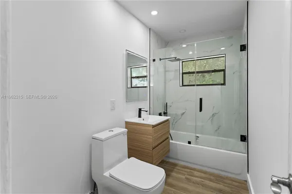 a bathroom with a sink toilet and bathtub