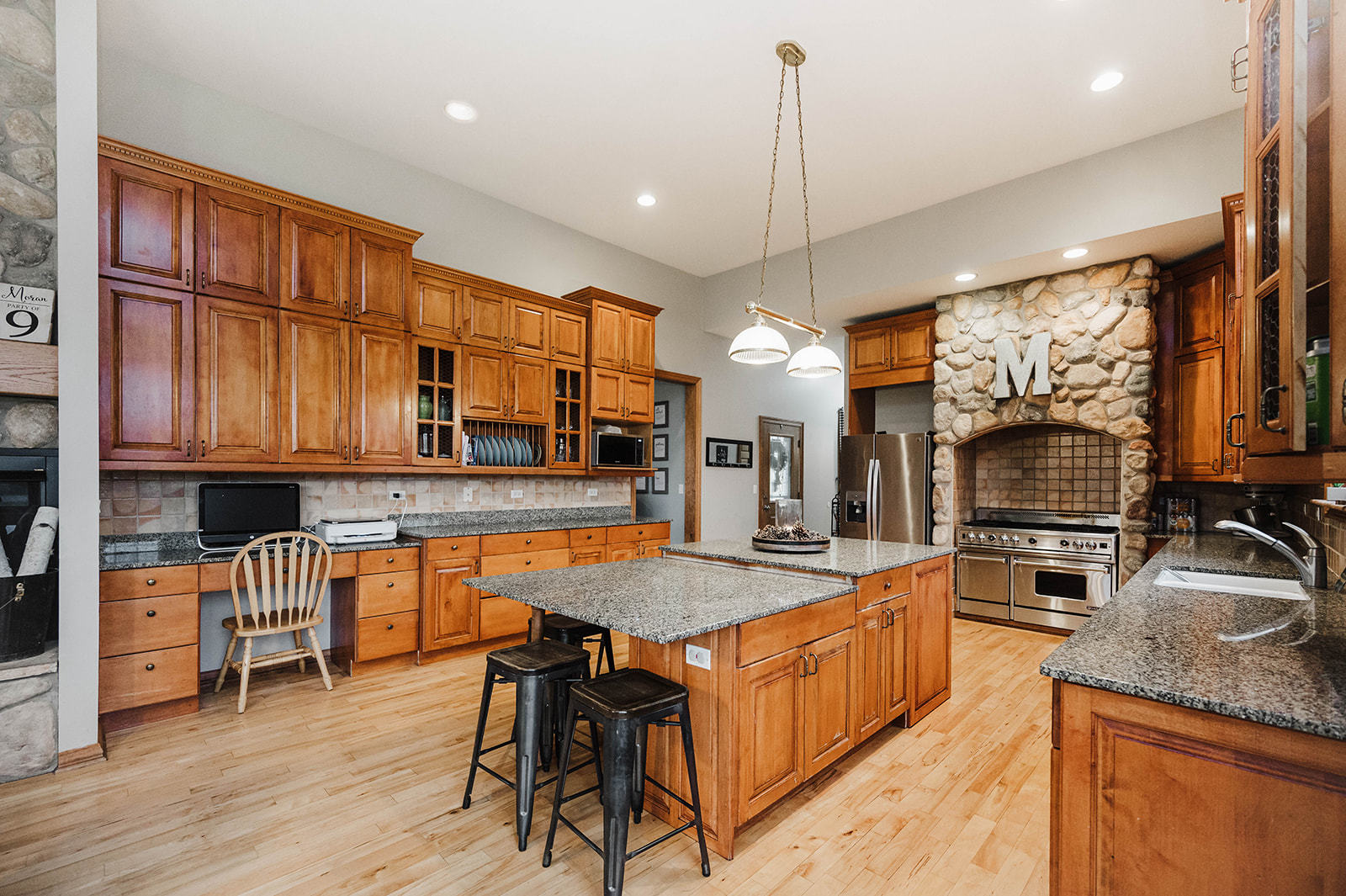 9S151 Granart Road Plano, IL 60545 - Photo 8 of 48 a large kitchen with kitchen island a large island in the center