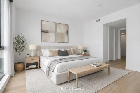 a bedroom with a bed and a couch