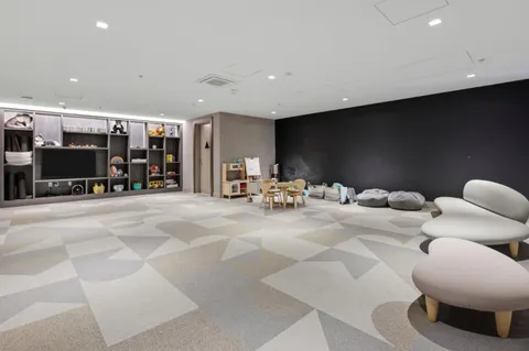 a room with gym equipment and a large window