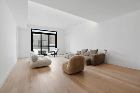 a bedroom with bed and a window