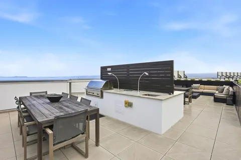a terrace with a table and chairs