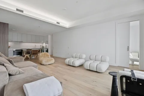 a living room with furniture and white walls