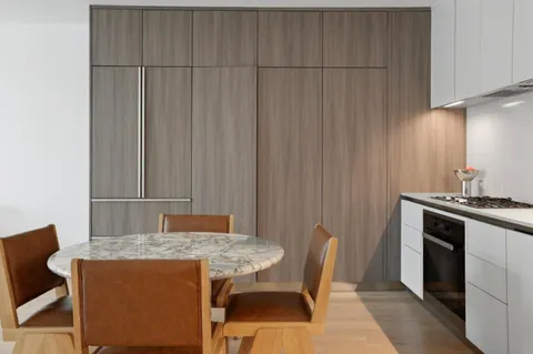 a view of a table and chairs in a kitchen