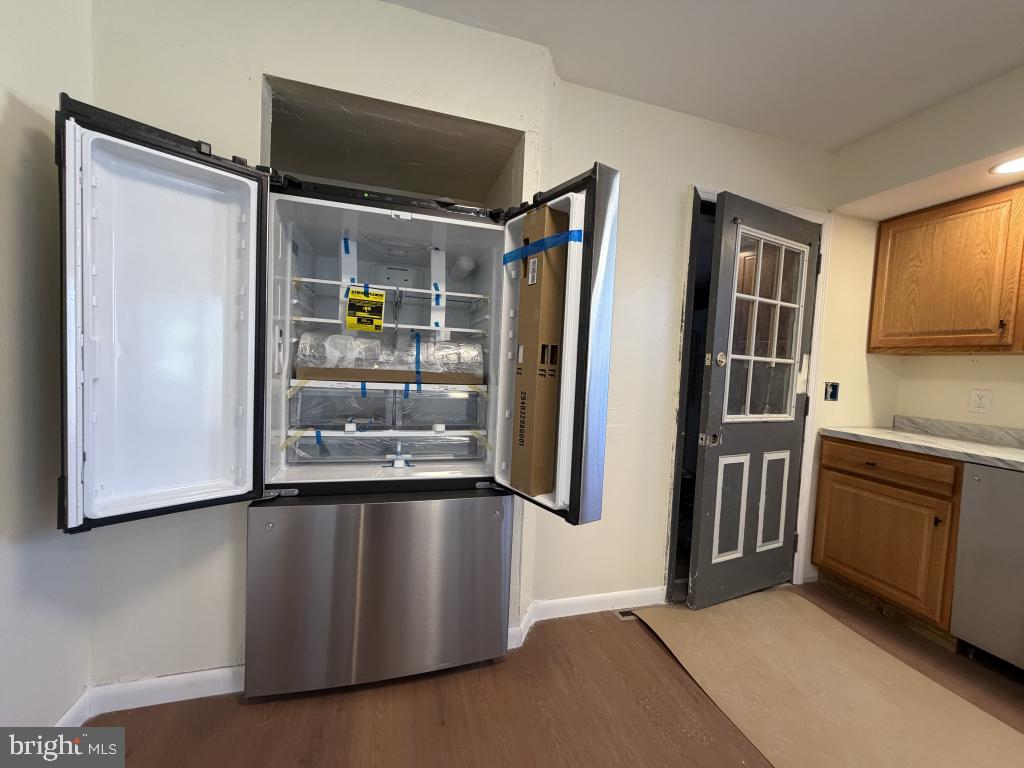 322 Nicholson Road Mount Ephraim, NJ 08059 - Photo 13 of 45 a hallway with stainless steel appliances granite countertop a refrigerator and a stove top oven
