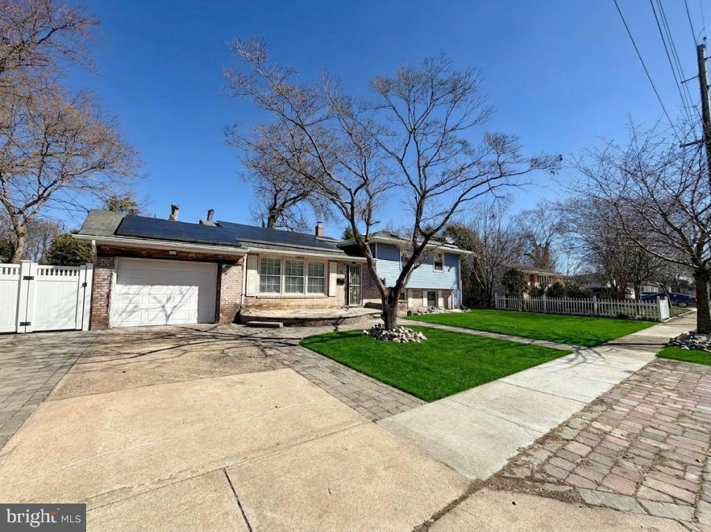 322 Nicholson Road Mount Ephraim, NJ 08059 - Photo 2 of 45 a front view of a house with a yard and trees