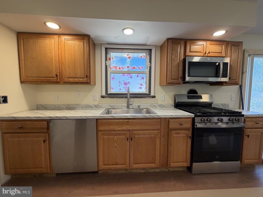 322 Nicholson Road Mount Ephraim, NJ 08059 - Photo 10 of 45 a kitchen with a sink stove top oven and microwave