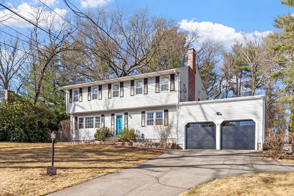 21 Potter Road Framingham, MA 01701 - Photo 1 of 42 a front view of a house with a yard and trees