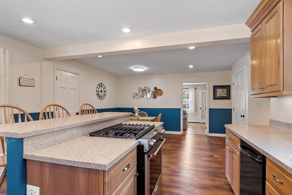 21 Potter Road Framingham, MA 01701 - Photo 11 of 42 a kitchen with stainless steel appliances granite countertop a stove a sink a refrigerator and a refrigerator