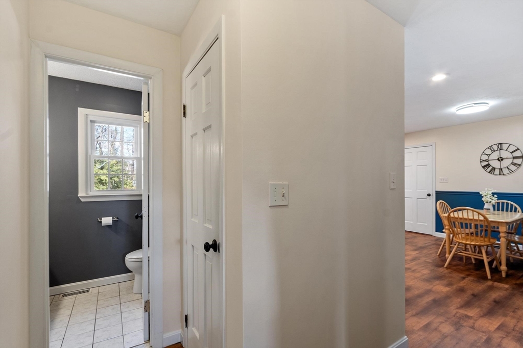 21 Potter Road Framingham, MA 01701 - Photo 15 of 42 a view of a hallway with chairs and a table in a room