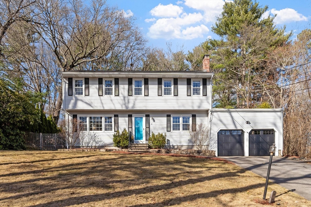21 Potter Road Framingham, MA 01701 - Photo 2 of 42 a front view of a house with yard and trees around