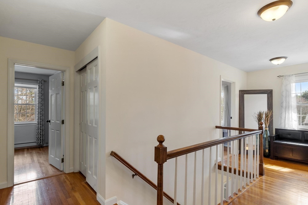 21 Potter Road Framingham, MA 01701 - Photo 23 of 42 a view of a hallway with wooden floor and staircase