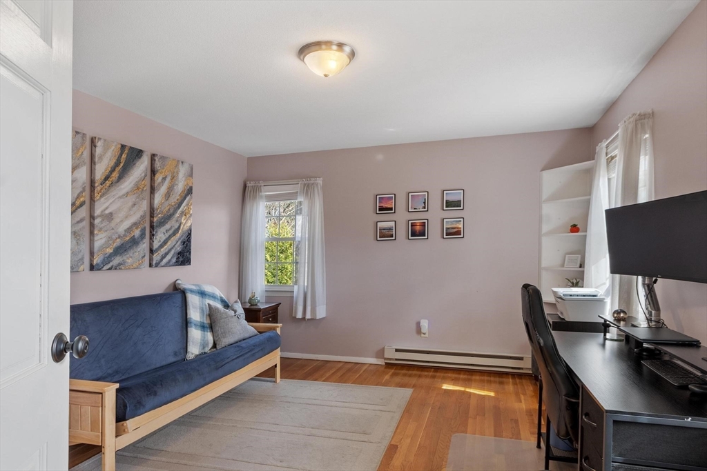 21 Potter Road Framingham, MA 01701 - Photo 28 of 42 a living room with furniture and a flat screen tv