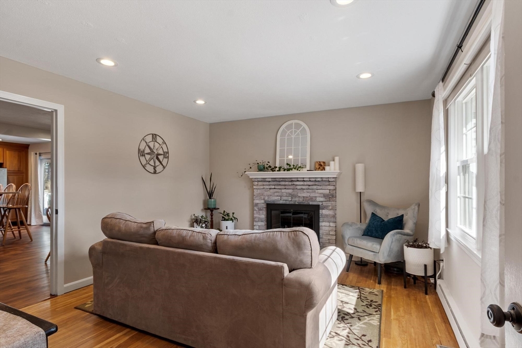21 Potter Road Framingham, MA 01701 - Photo 3 of 42 a living room with furniture and a fireplace