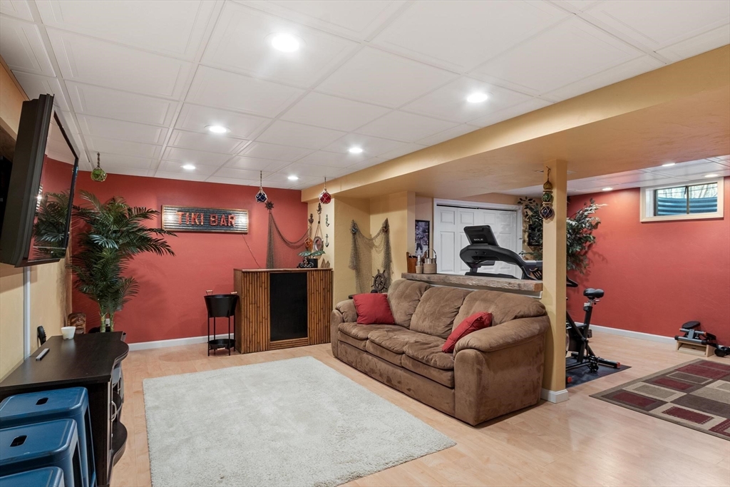 21 Potter Road Framingham, MA 01701 - Photo 32 of 42 a living room with furniture and a flat screen tv