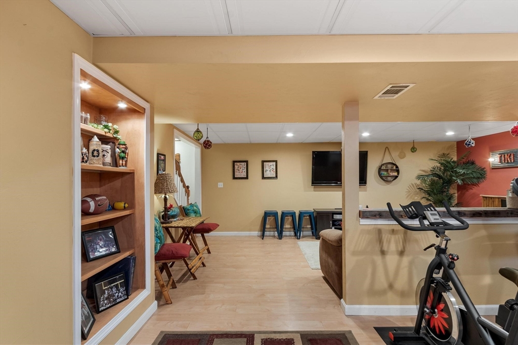 21 Potter Road Framingham, MA 01701 - Photo 35 of 42 a living room with furniture and a flat screen tv