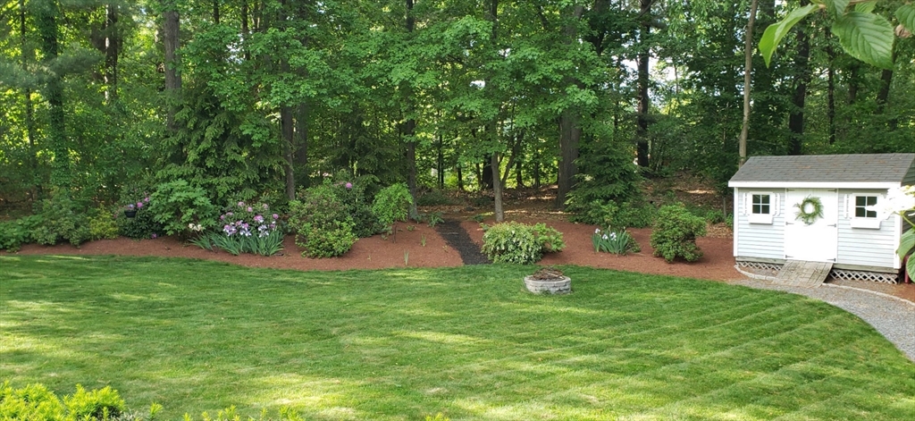 21 Potter Road Framingham, MA 01701 - Photo 40 of 42 a view of a backyard with a garden